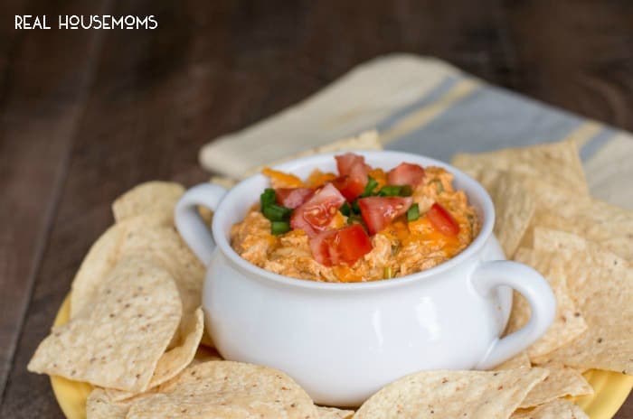 This fun recipe for SLOW COOKER CHICKEN TACO DIP is great to serve at your next party or game day!