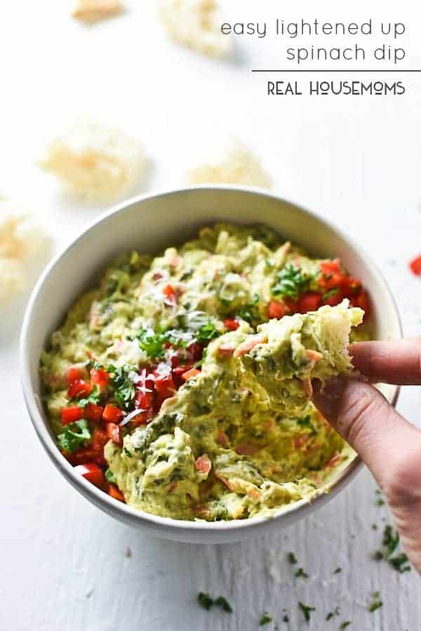 This EASY LIGHTENED UP SPINACH DIP is full of veggies and uses Greek yogurt to give you a creamy dip you'll crave!