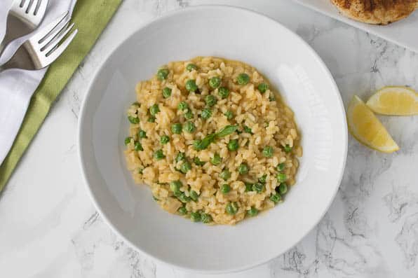 LEMON RISOTTO WITH ENGLISH PEAS is a creamy comforting dish that will complement any meat, seafood or roasted vegetables!