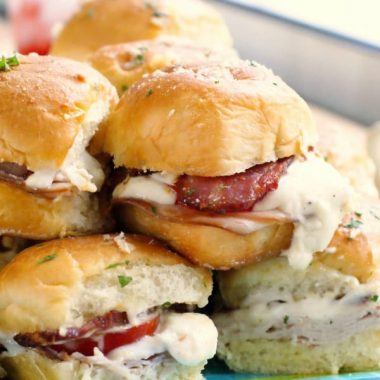 KENTUCKY HOT BROWN SLIDERS are a twist on the classic open-faced sandwich that features turkey, bacon, tomatoes and a Pecorino Romano cheese sauce!