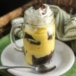 Our IRISH CREAM BROWNIE PARFAIT makes a perfect dessert for St. Patrick's Day with its layers of delicious chocolate fudge brownies and pudding in a mason jar or parfait glass!