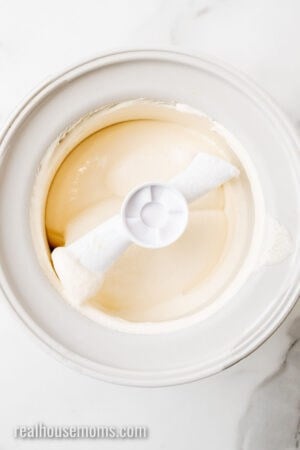 vanilla keto ice cream in a KitchenAid ice cream bowl after churning