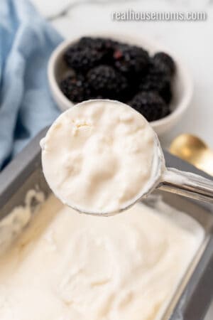 ice cream scoop of homemade keto ice cream over the loaf pan