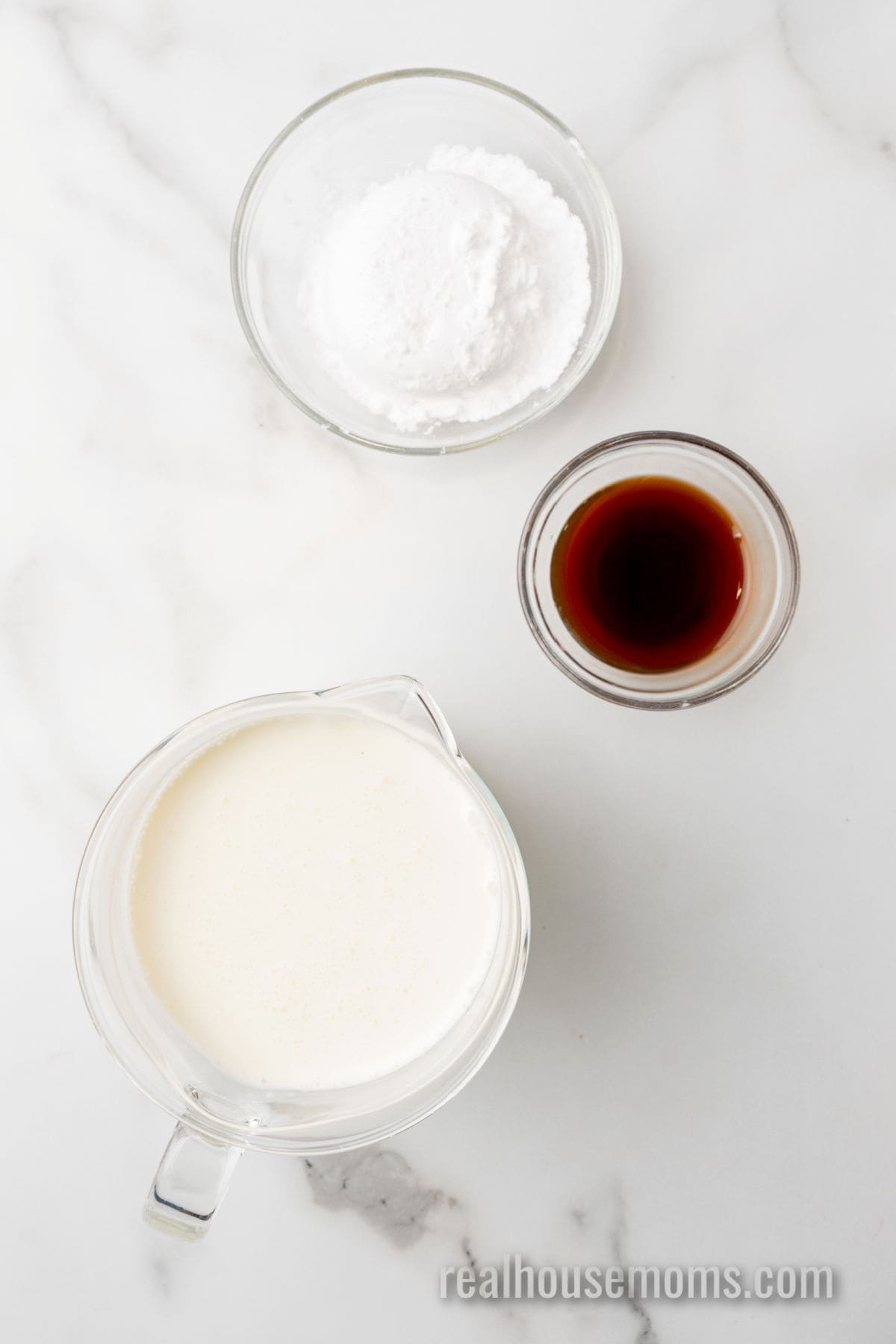 ingredients to make homemade keto ice cream in bowls on a counter