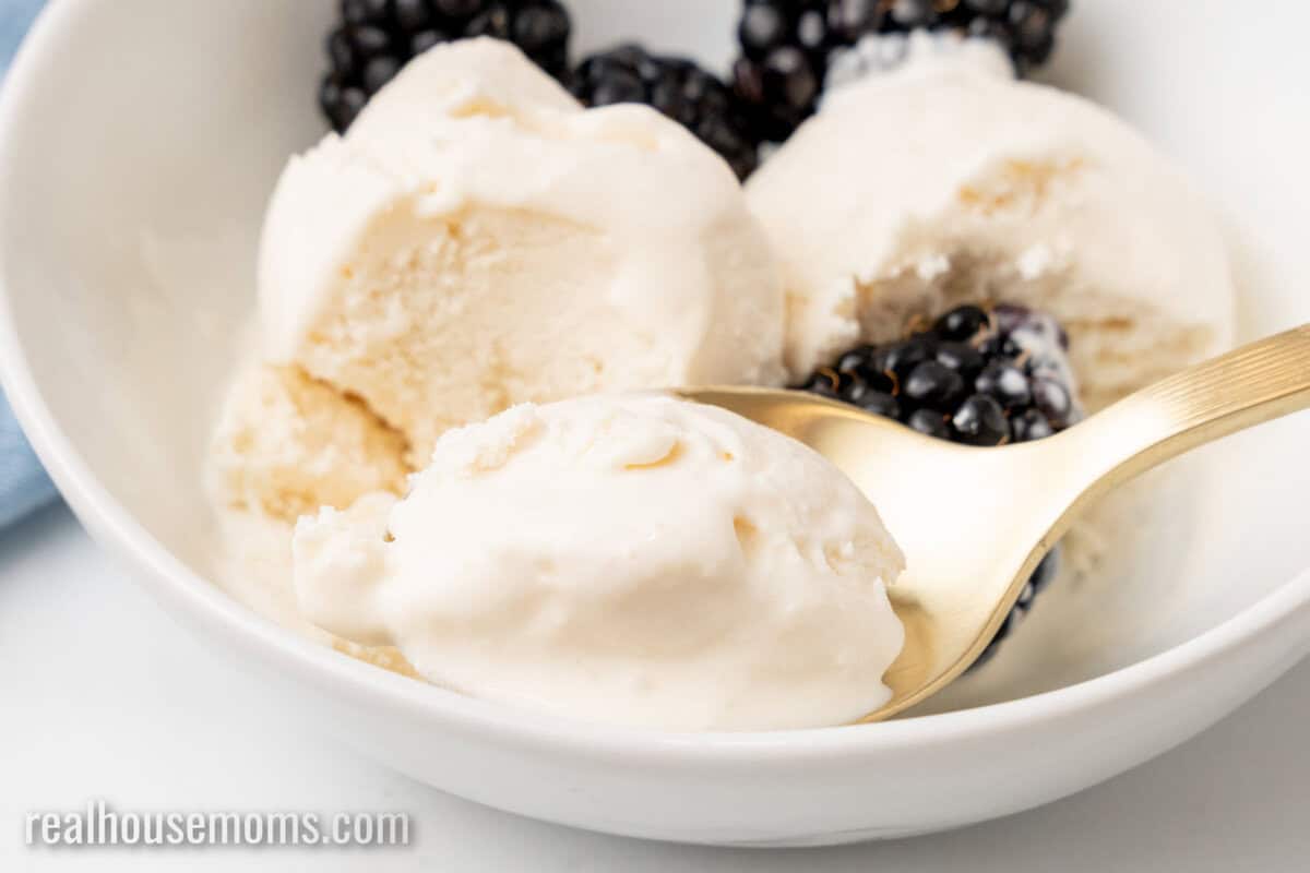 bite of 3-ingredient keto ice cream on a spoon resting in the bowl