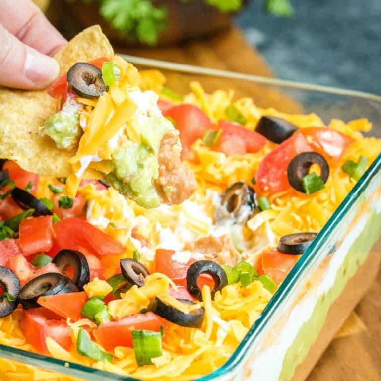 7 Layer Dip is easy to make crowd favorite that's packed full of flavor.  Always a hit at parties it covers all the best ingredients you cannot go wrong!
