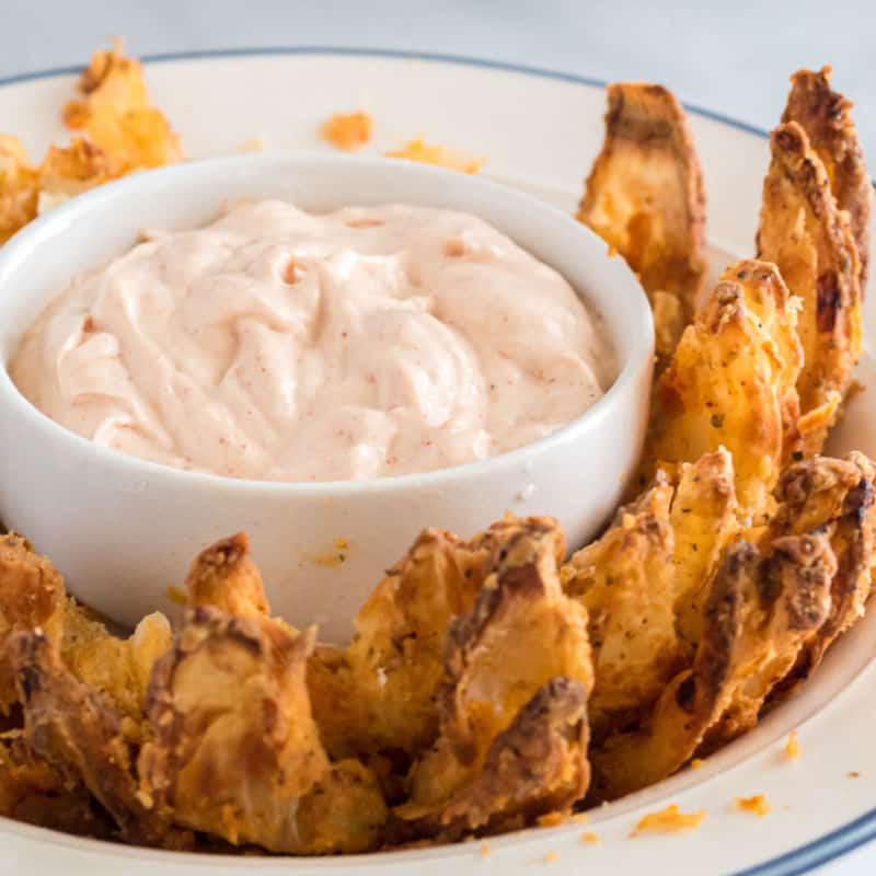 Crispy, salty & JUST as good as your local restaurant! An Air Fryer Blooming Onion is the perfect way to satisfy your fried food craving without the guilt!