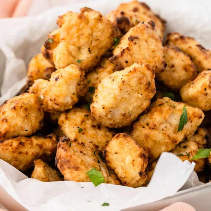 square image of air fryer chick-fil-a chicken nuggets piled up in a basket
