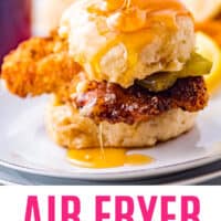 air fryer chicken biscuit sandwich with honey being drizzled over top with recipe name at the bottom