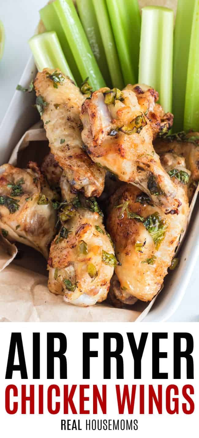 cilantro jalapeno lime chicken wings in a basket with celery sticks