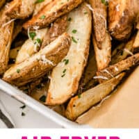 air fryer garlic parmesan potato wedges piled up on a basket with recipe name at the bottom