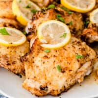 square close up of air fryer lemon pepper chicken thighs