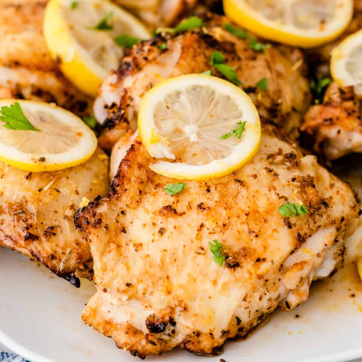 square close up of air fryer lemon pepper chicken thighs