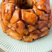 air fryer monkey bread on a serving plate with recipe name at the bottom