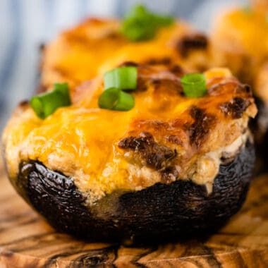 square close up image of an air fryer stuffed mushroom