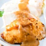 square image of air fryer turkey breast slices topped with gravy