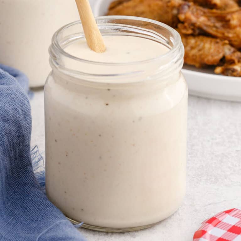 square image of alabama white sauce in a mason jar