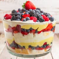 square image of an angel food cake berry trifle topped with a whole strawberry