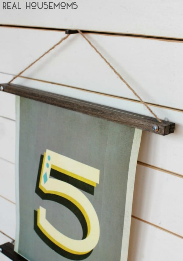 With a couple supply items, you can make a DIY WOODEN PICTURE HANGER for a fraction of the cost of the one from Anthropologie!