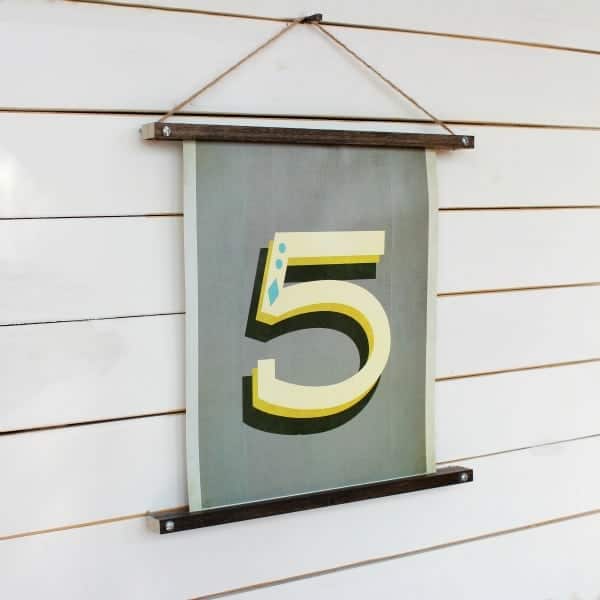 With a couple supply items, you can make a DIY WOODEN PICTURE HANGER for a fraction of the cost of the one from Anthropologie!