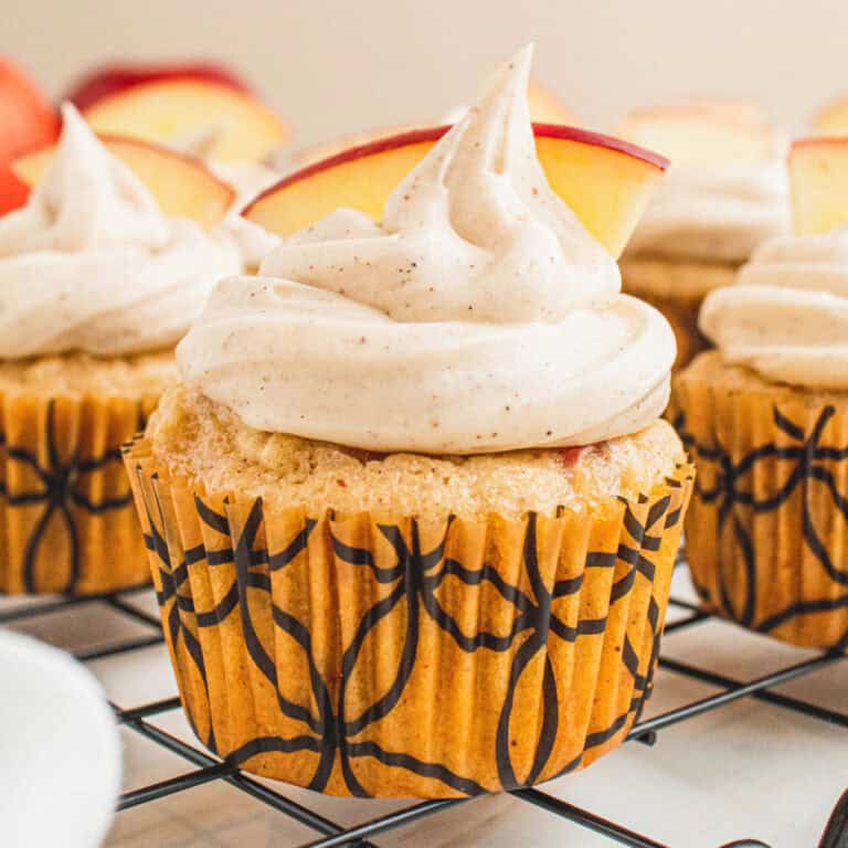 square image of apple cider cupcakes on a wire rack
