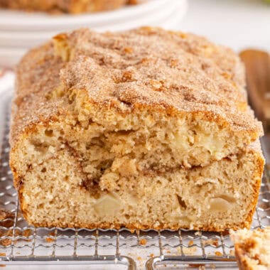 square image of apple cinnamon bread on top of a baking rack