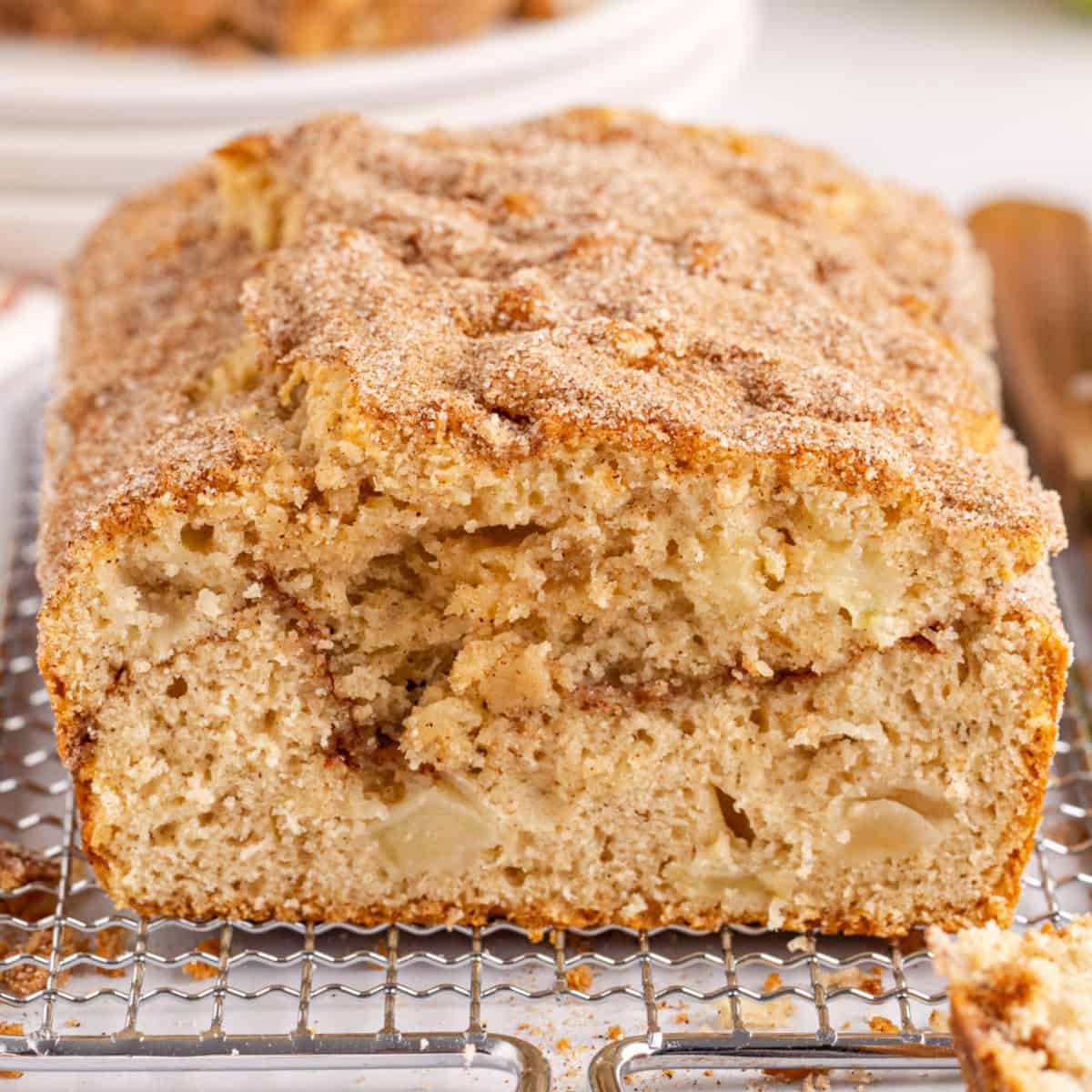 square image of apple cinnamon bread on top of a baking rack