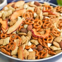 square image of apple cinnamon snack mix in a serving bowl