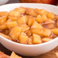 square close up image of apple pie dip in a bowl