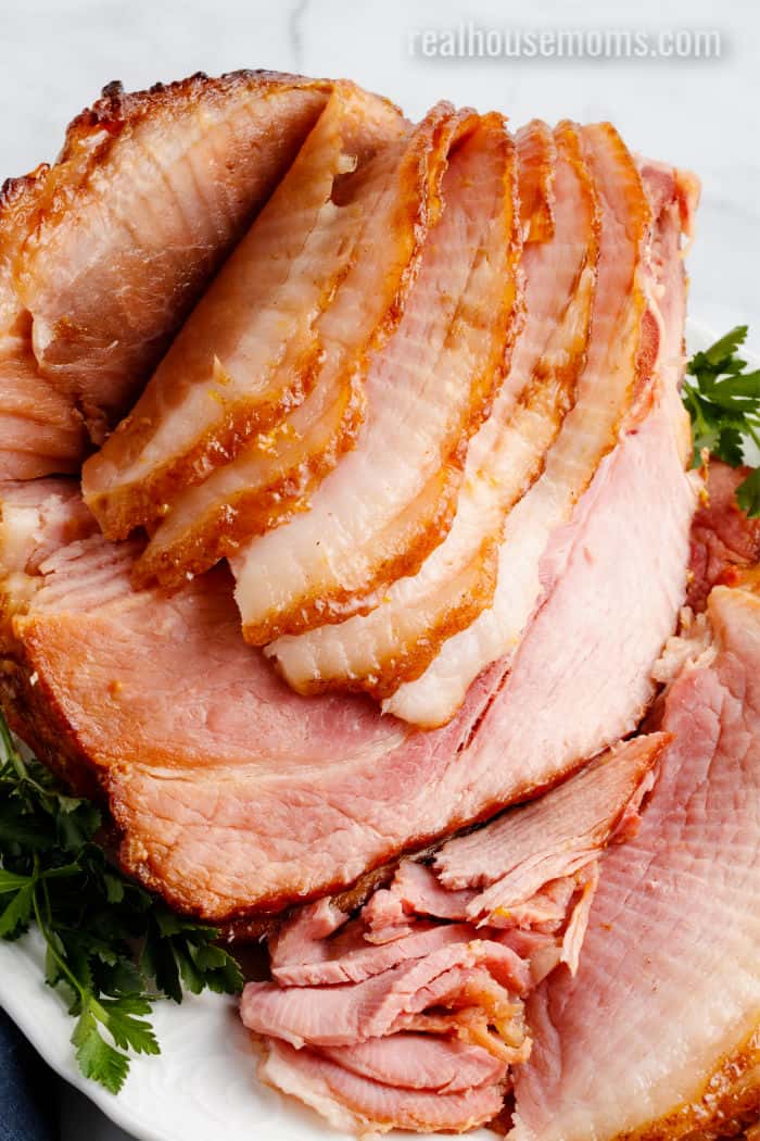 spiral cut glazed ham on a serving platter