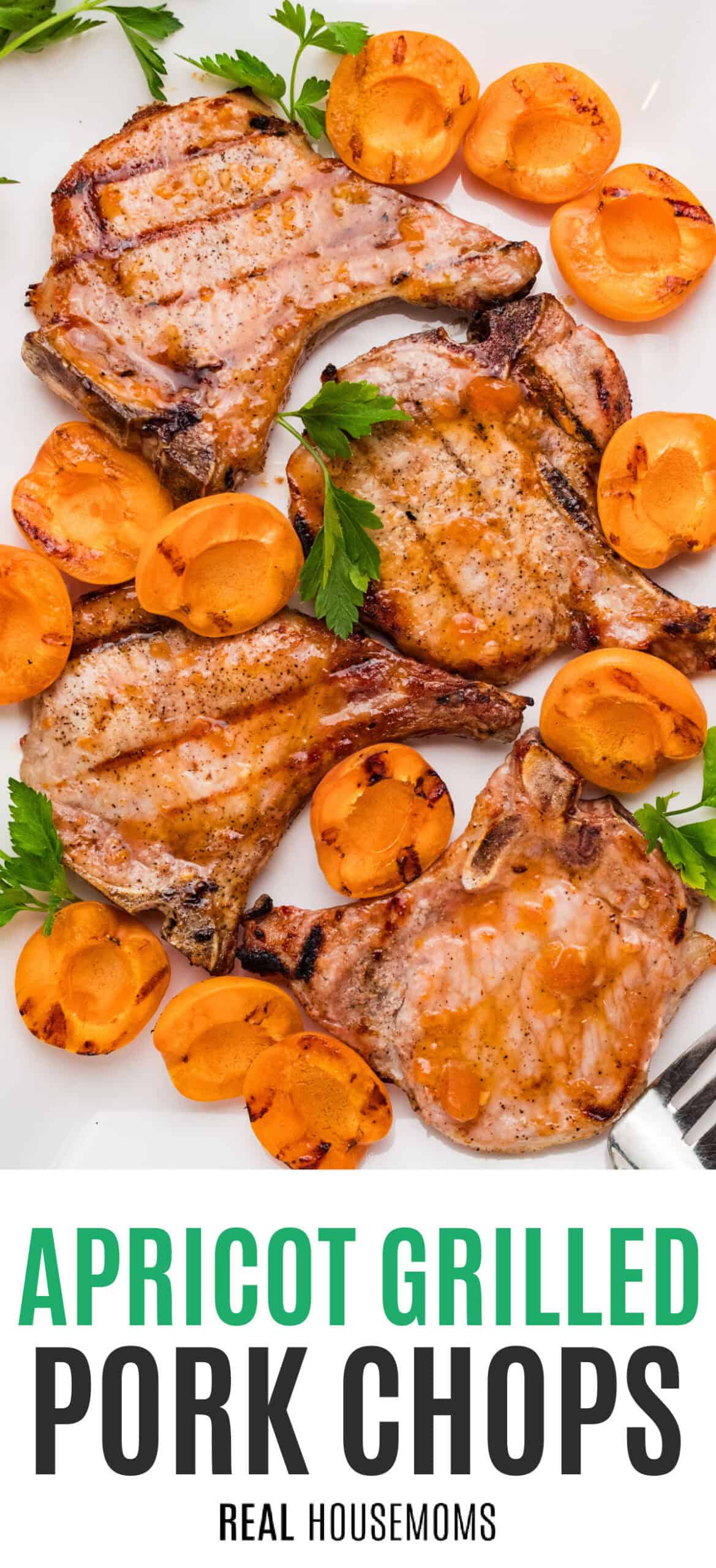 apricot grilled pork chops on a platted with apricots with recipe name at the bottom