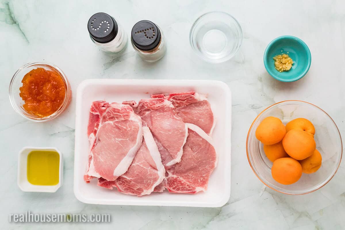 ingredients to make apricot grilled pork chops laid out on a counter