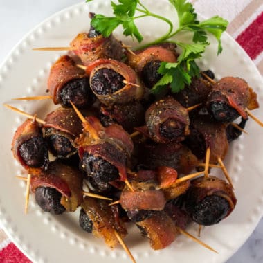 The perfect blend of sweet and salty, Bacon Wrapped Figs are a unique appetizer that's sure to impress your guests! You can even prep them ahead of time and bake 'em later!