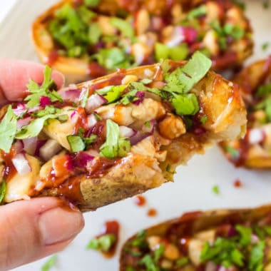 Cheesy, crispy, and dripping with sauce, these BBQ Chicken Potato Skins are the ultimate football party food! Make then ahead of time and bake when ready!