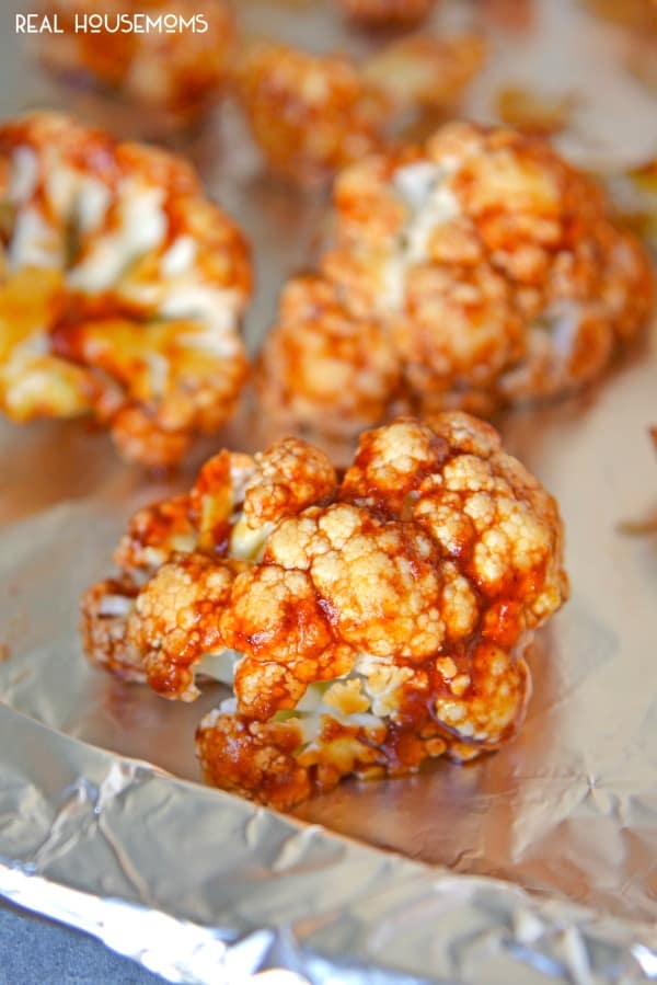 BBQ cauliflower bites on a baking sheet ready to be cooked