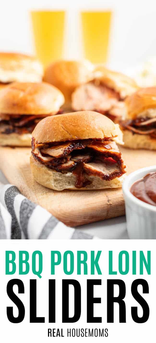 grilled, sliced pork loin on dinner rolls with BBQ sauce on a cutting board