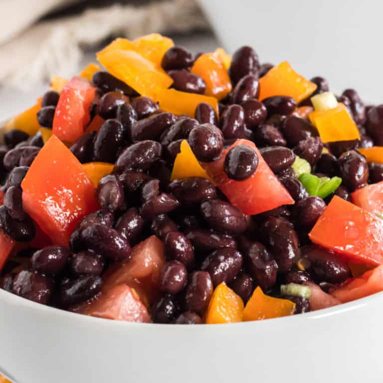 Tangy, bright & full of nutrition, Black Bean Salad is the perfect dish to share with friends! Use it as a dip or an appetizer - your guests will LOVE it!