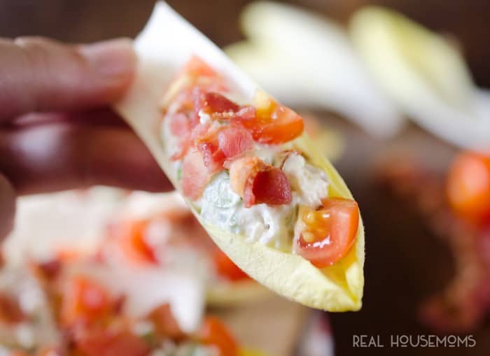 BLT ENDIVE BITES are a unique twist on BLT for an easy 10-minute appetizer that will impress your party guests. These bite-sized finger foods are lightened up with Greek Yogurt but have all the rich and delicious flavors of the classic sandwich!