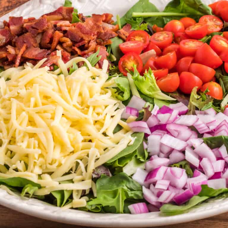 square image of BLT salad in a serving bowl before tossing