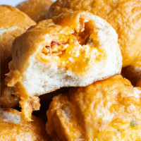 You're gonna love this ultimate appetizer! Bacon Jalapeno Popper Pretzel Bites are filled with gooey cheese, crispy bacon, and jalapeño peppers for the best party bite!