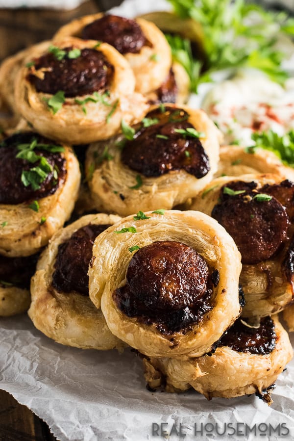 These delicious Chorizo Pinwheel Bites are stuffed with cheddar, drizzled with honey, and then baked until the pastry is puffed and golden. They can even be made a day ahead for a quick and easy appetizer!