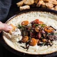 This Baked Goat Cheese Dip is topped with tomatoes, basil, and balsamic and is crazy delicious!
