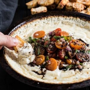 This Baked Goat Cheese Dip is topped with tomatoes, basil, and balsamic and is crazy delicious!