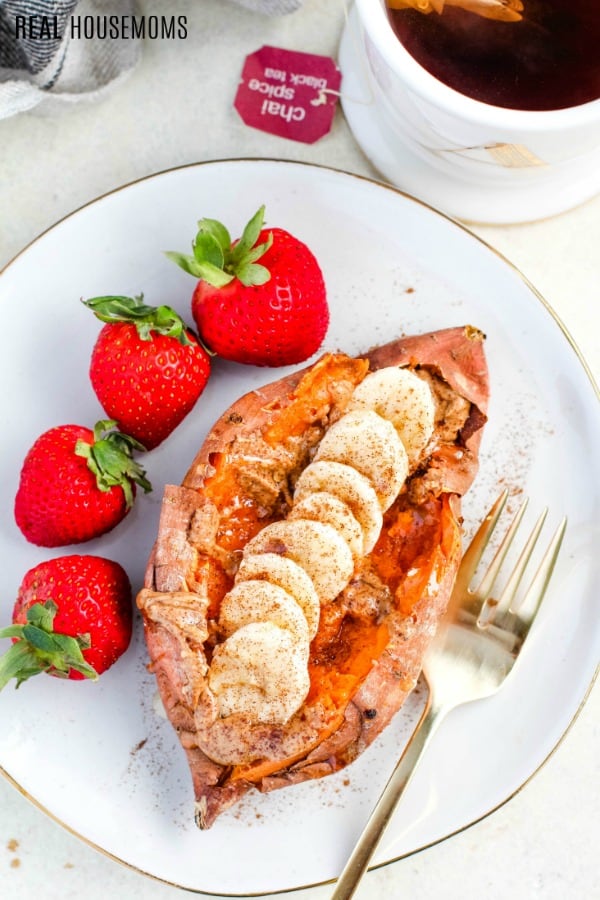 baked sweet potato topped with honey, bananas, and peanut butter