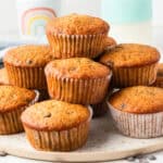 square image of banana chocolate chip muffins piled on a plate