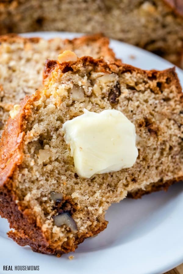close up of banana nut bread slice with butter