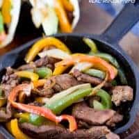 These flavorful BEEF FAJITAS are tender beef marinated in a delicious sauce, and cooked with peppers and onions for a fantastic and delicious meal!