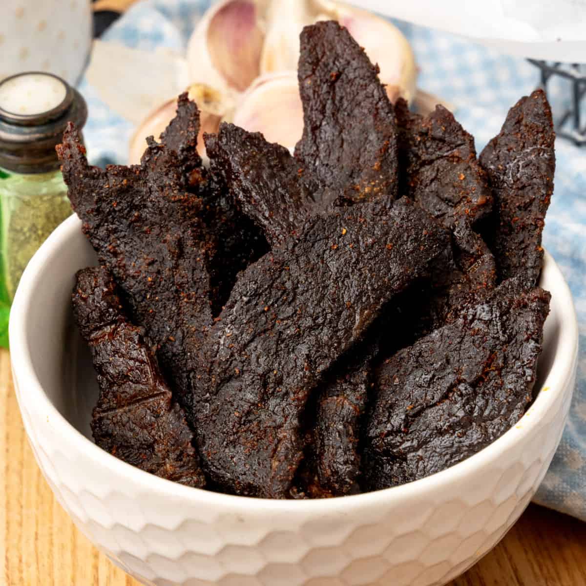 square image of beef jerky in a bowl