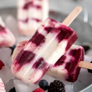 Cool down this summer with these sweet, refreshing, and healthy Berries & Cream Popsicles!