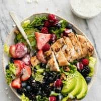 Easy and healthy Berry Avocado Grilled Chicken Salad is a cinch to whip up in just 30 minutes with incredible flavors and textures. The poppyseed dressing brings all of those flavors together in this yummy salad!